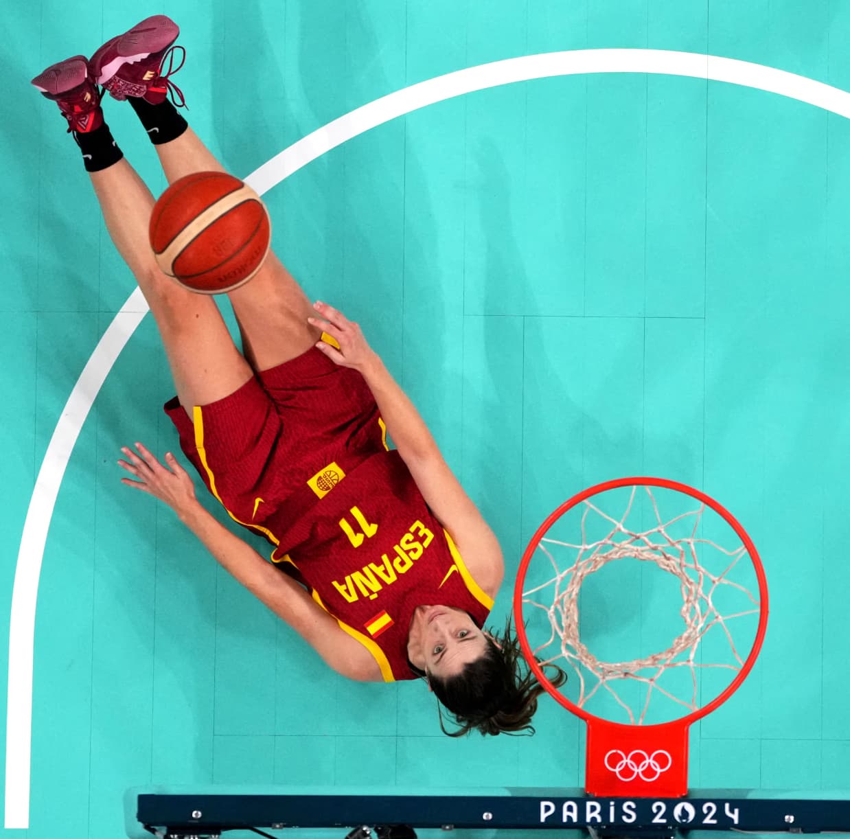 Spanish basketball player Leonor Rodriguez slips during a match against Puerto Rico. 